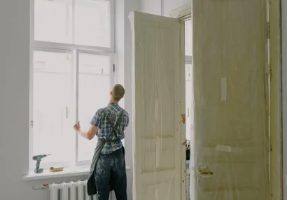 Man installing window on new build property
